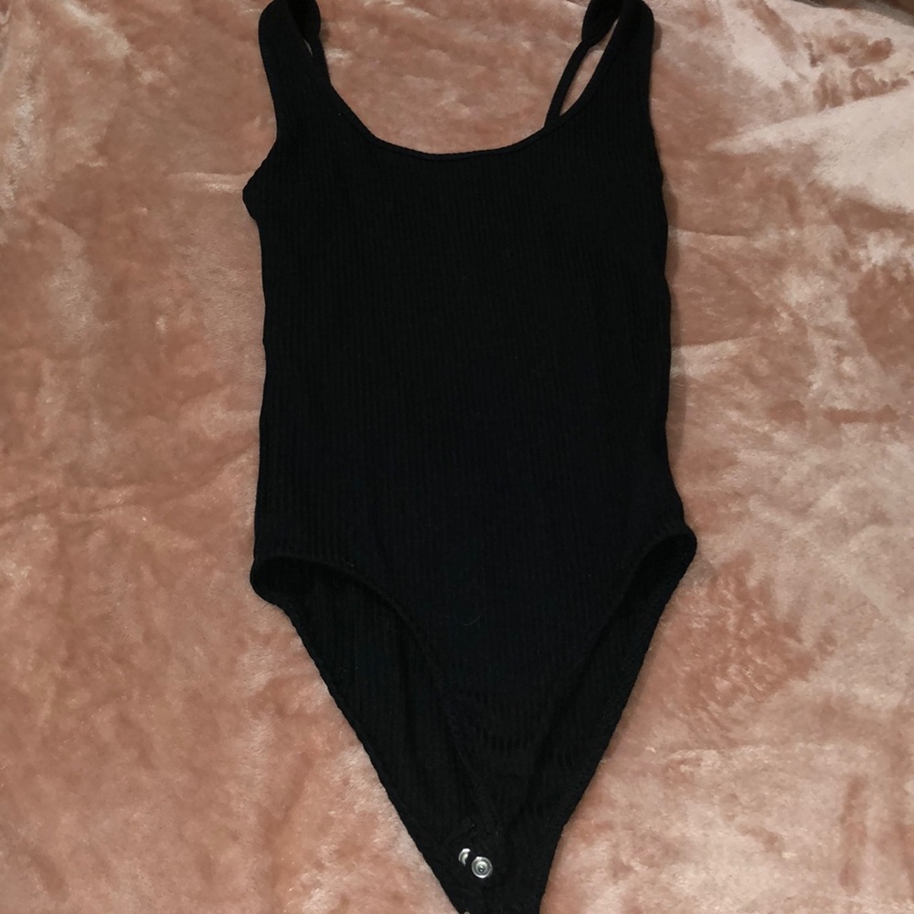 Black bodysuit more in the open back super cute
